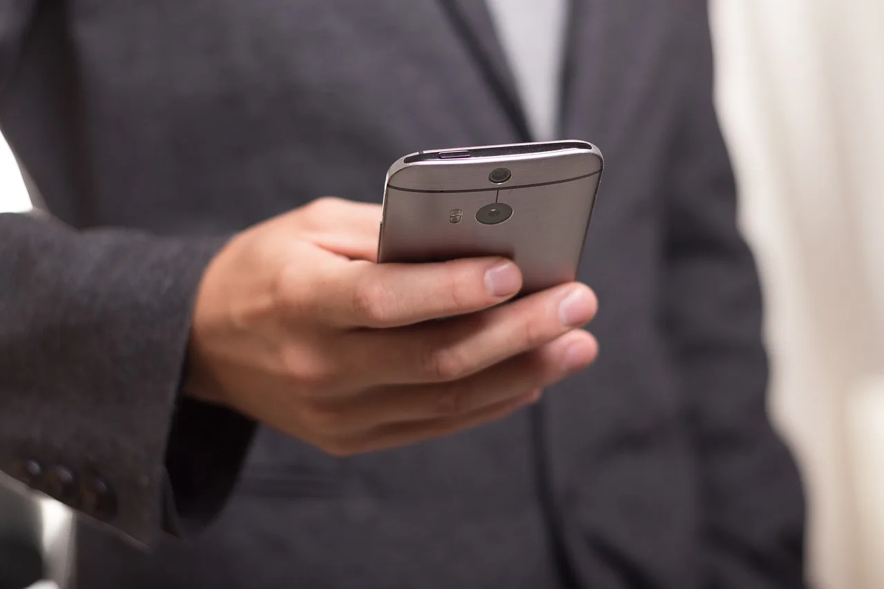 Hand holding smartphone